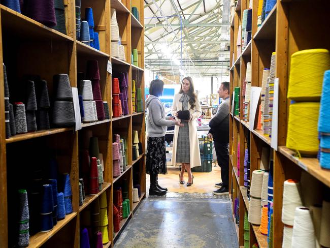 She also spent time with members of the production team on the factory floor during a visit to Corgi, a family run textiles manufacturer focused on the production of socks and knitwear. Picture: AFP