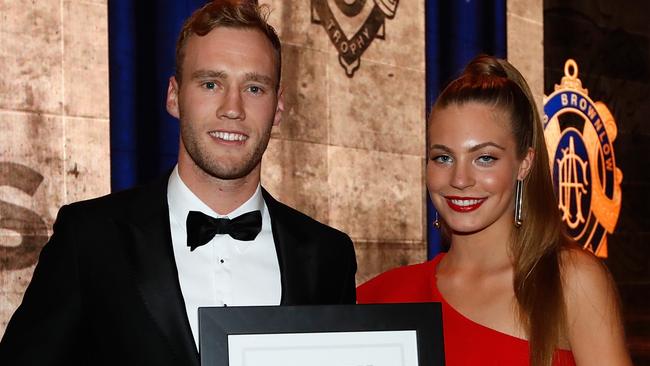 MELBOURNE, AUSTRALIA - SEPTEMBER 25: Jack Hombsch of the Power is presented with the Jim Stynes Community Leadership Award by Matisse Stynes during the 2017 Brownlow Medal Count at the Crown Palladium on September 25, 2017 in Melbourne, Australia. (Photo by Michael Willson/AFL Media)