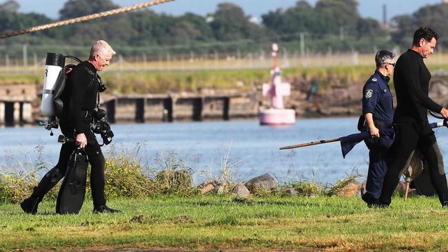 Police divers searched the waters off the coast of the Newcastle port where the deceased man washed onto the shore. Picture: Peter Lorimer