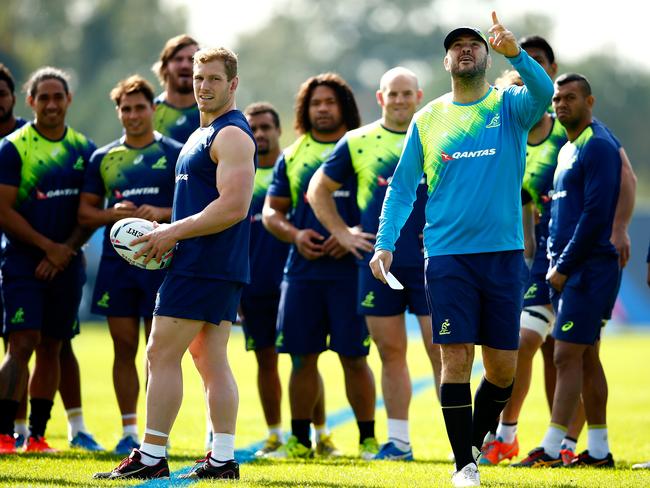 Michael Cheika takes charge during a training session at the University of Bath.