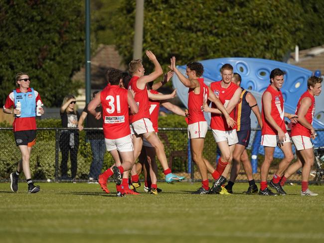 East Brighton players celebrate a late goal. Picture: Valeriu Campan