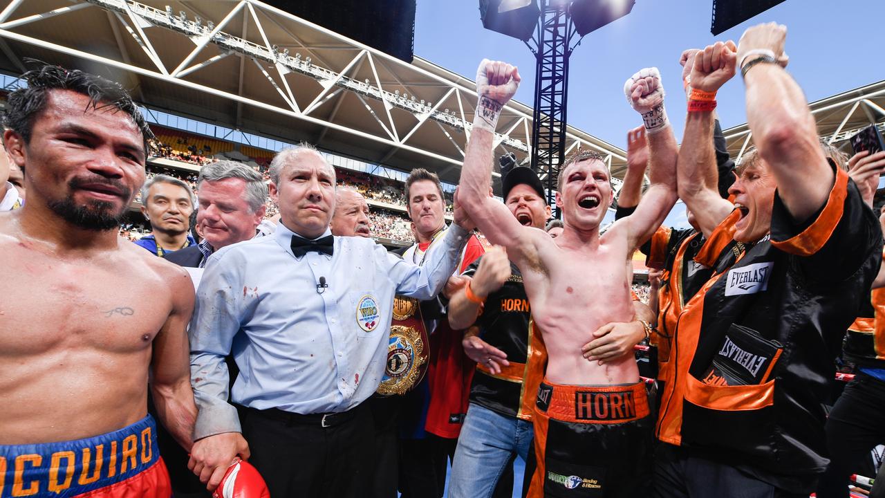 Jeff Horn (2nd R) of Australia celebrates beating Manny Pacquiao (L).