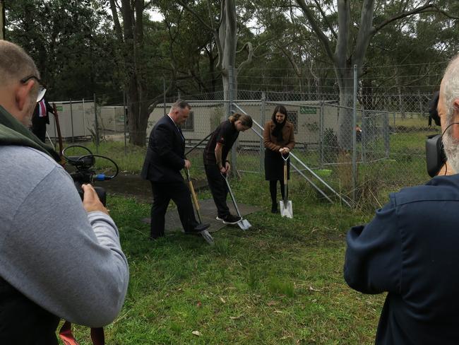 Terrigal State Liberal MP Adam Crouch, Gorokan High School Year 12 student Jock Clenton and NSW Premier Gladys Berejiklian turn the first sod at the new Porters Creek Public School at Warnervale. Picture: Richard Noone