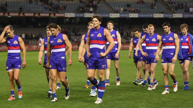 Bulldogs leaders Daniel Giansiracusa, Ryan Griffen and Will Minson lead the team off the field. Picture: Getty