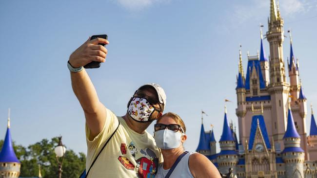 Guests take a selfie at Walt Disney World in Florida last year. Picture: Getty Images