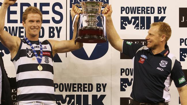 Port Melbourne vs Geelong at Etihad Stadium. Troy Selwood and Matthew Knights hold the cup aloft