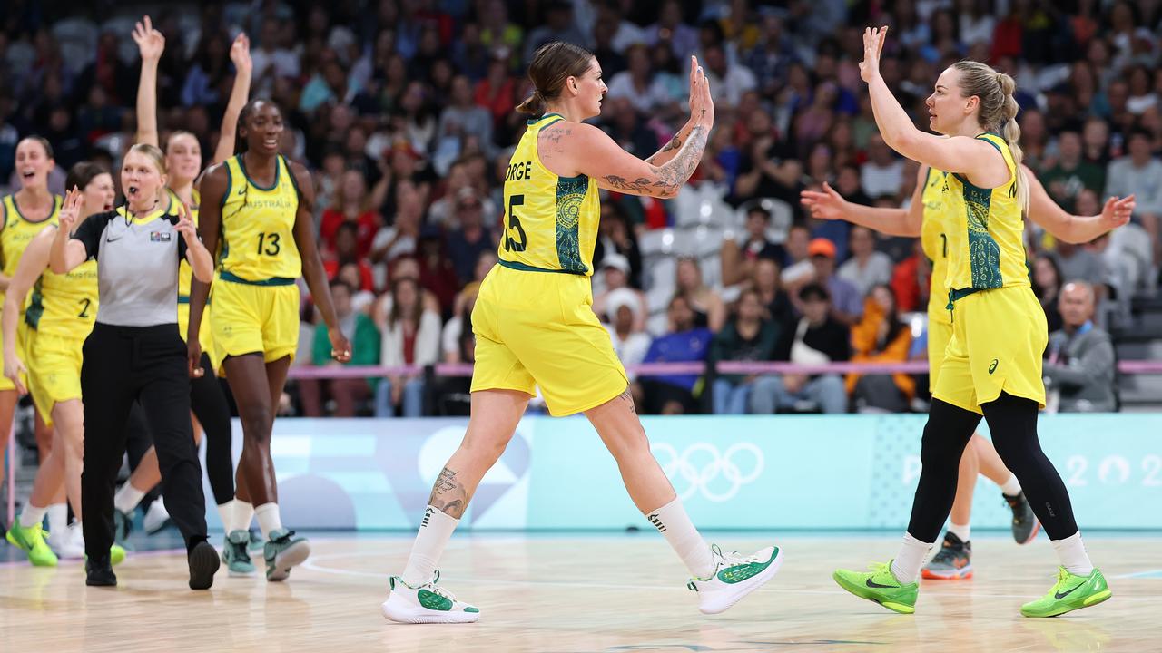 It feels good to be alive: Cayla George and Lauren Jackson bring it in after the win. Picture: Gregory Shamus/Getty Images