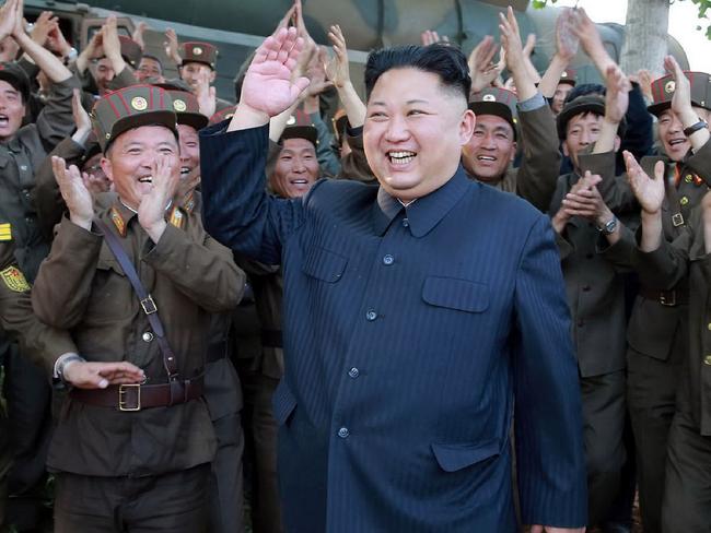 CORRECTION - This undated picture released from North Korea's official Korean Central News Agency (KCNA) on May 22, 2017 shows North Korean leader Kim Jong-Un (C) smiling while inspecting the test-fire of a ground-to-ground medium-to-long range strategic ballistic missile Pukguksong-2.  North Korea on May 22 declared its medium-range Pukguksong-2 missile ready for deployment after a weekend test, the latest step in its quest to defy UN sanctions and develop a weapon capable of striking US targets. / AFP PHOTO / KCNA VIA KNS / STR / South Korea OUT / REPUBLIC OF KOREA OUT   ---EDITORS NOTE--- RESTRICTED TO EDITORIAL USE - MANDATORY CREDIT "AFP PHOTO/KCNA VIA KNS" - NO MARKETING NO ADVERTISING CAMPAIGNS - DISTRIBUTED AS A SERVICE TO CLIENTS THIS PICTURE WAS MADE AVAILABLE BY A THIRD PARTY. AFP CAN NOT INDEPENDENTLY VERIFY THE AUTHENTICITY, LOCATION, DATE AND CONTENT OF THIS IMAGE. THIS PHOTO IS DISTRIBUTED EXACTLY AS RECEIVED BY AFP.  / “The erroneous mention[s] appearing in the metadata of this photo by STR has been modified in AFP systems in the following manner: [correcting source and restrictions]. Please immediately remove the erroneous mention[s] from all your online services and delete it (them) from your servers. If you have been authorized by AFP to distribute it (them) to third parties, please ensure that the same actions are carried out by them. Failure to promptly comply with these instructions will entail liability on your part for any continued or post notification usage. Therefore we thank you very much for all your attention and prompt action. We are sorry for the inconvenience this notification may cause and remain at your disposal for any further information you may require.”