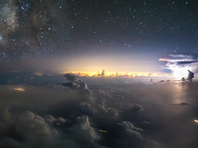 WEB VERSION ** A powerful lightning flashes off the east coast of the US with Miami lights on the backgroundPhoto © 2018 Santiago Borja. All rights reserved. www.santiagoborja.com