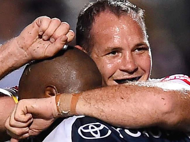 TOWNSVILLE, AUSTRALIA - SEPTEMBER 06: Robert Lui of the Cowboys celebrates his try with Matthew Scott during the round 26 NRL match between the North Queensland Cowboys and the Manly Sea Eagles at 1300SMILES Stadium on September 6, 2014 in Townsville, Australia. (Photo by Ian Hitchcock/Getty Images)