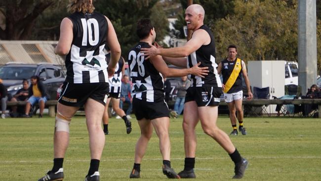 Merbein’s Vince Tassone and Ash Rowe celebrate a goal scored by Tassone against Red Cliffs in the Sunraysia league, at Dareton. Picture: Michael DiFabrizio