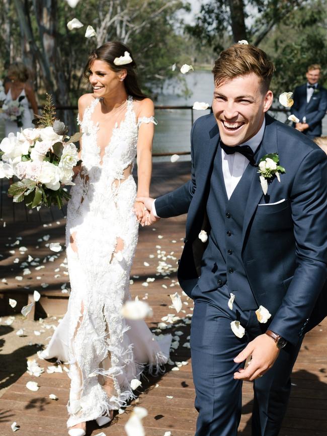 Melbourne co-captain Jack Viney and Charlotte Ennels on their wedding day. Picture: Chloe May