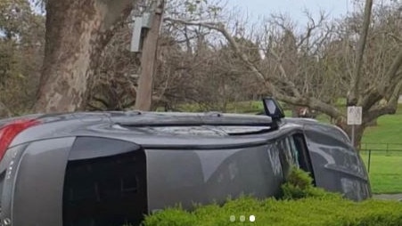 The grey vehicle overturned outside the cafe. Picture: Instagram/jacquifelgate