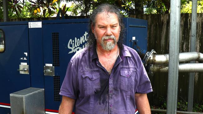 Klarwein Close resident Heinz Brettner in front of a water pump that stopped running on Wednesday when Ergon cut power to parts of Gordonvale. Picture: Peter Carruthers