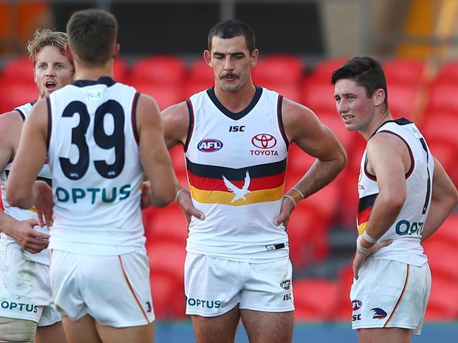 GOLD COAST, AUSTRALIA - JUNE 21: Taylor Walker and the Crows look on at half time duirng the round 3 AFL match between the Gold Coast Suns and the Adelaide Crows at Metricon Stadium on June 21, 2020 in Gold Coast, Australia. (Photo by Chris Hyde/Getty Images)