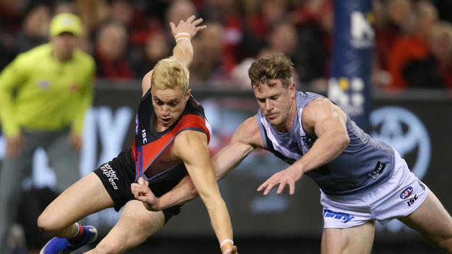 Tom Jonas battles former Norwood teammate Orazio Fantasia during Port’s win over Essendon this past season. Picture: Michael Klein