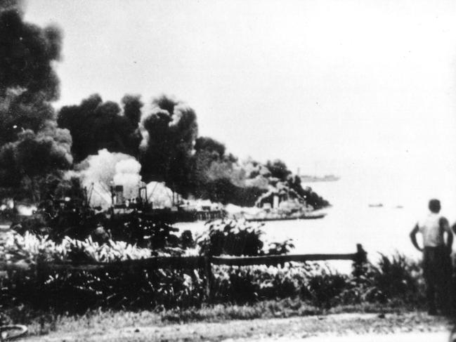 Actual photographs of the Darwin Harbour and the USS Peary up in smoke after the Japanese army bombed Darwin on February 19, 1942. Circa: No date.