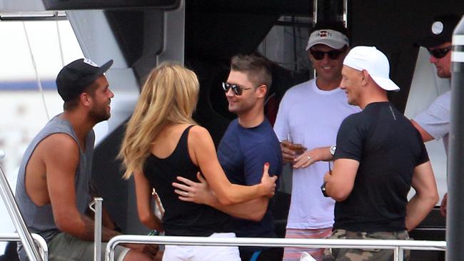 Back in the day: Buddy Franklin, Michael Clarke, Anthony Bell and Karl Stefanovic enjoying drinks on Anthony Bell boat Ghost. They were later join by ex-model Laura Csortan.