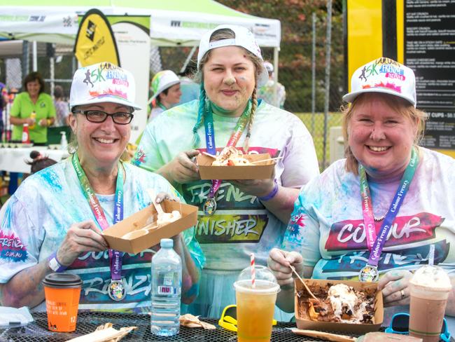 Helen Wardrop, Aimee Dittmer and Saraya Brickwood from Sarina at the Mackay Colour Run 2021. Picture: Michaela Harlow