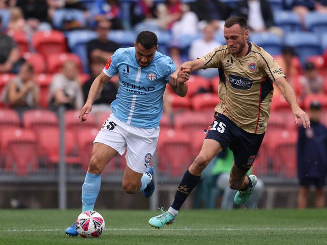 City’s Andrew Nabbout looks for a way past Newcastle’s Aleksandar Šušnjar. Picture: Getty Images