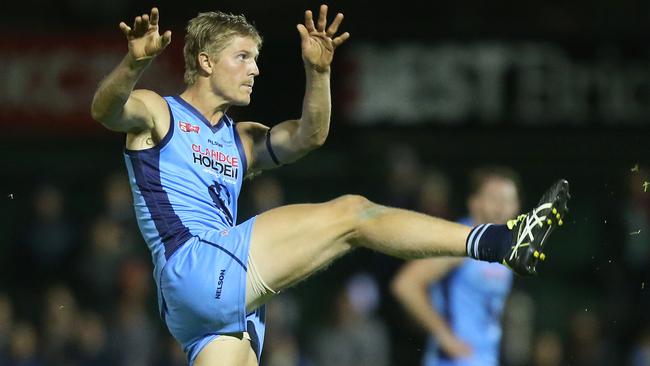 Sturt’s Kory Beard sends his team forward. Picture: Stephen Laffer