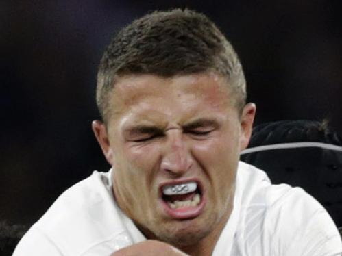 England’s Sam Burgess, centre is tackled by France’s Flugence Ouedraogo, left and France’s Yoann Maestri right, during an international friendly rugby match between England and France at Twickenham stadium in London, Saturday, Aug. 15, 2015. A series of friendly internationals are being held in advance of the upcoming Rugby World Cup that starts in September. (AP Photo/Alastair Grant)