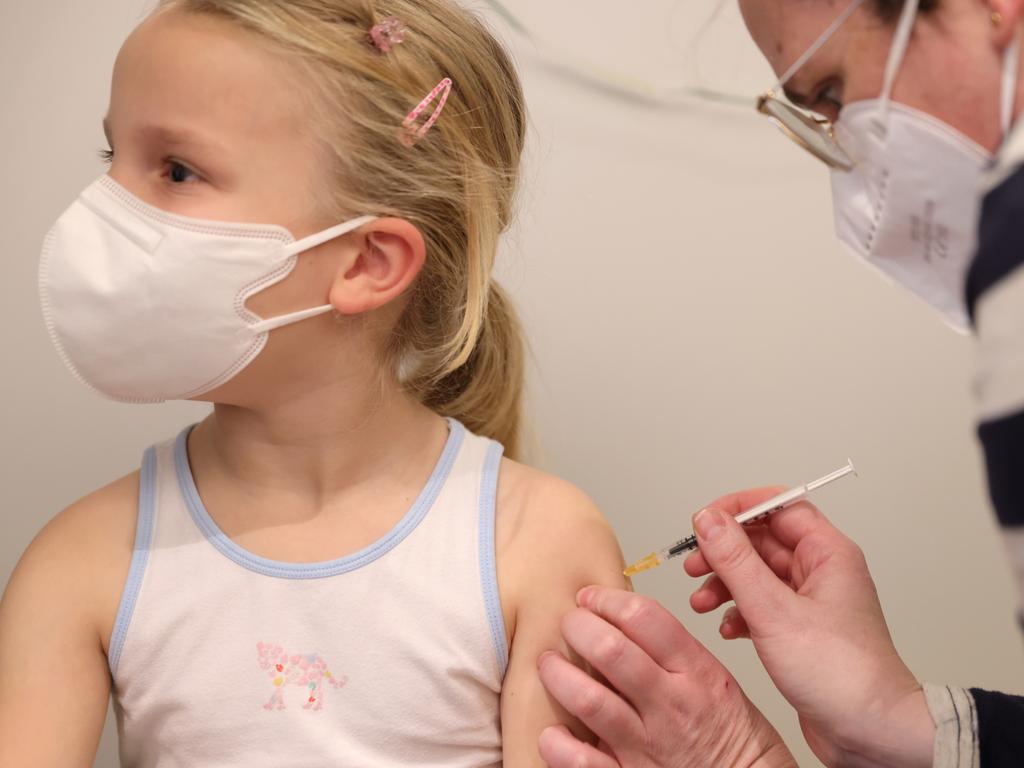 A child receives the Pfizer vaccine in Cologne, Germany. Picture: Andreas Rentz/Getty Images