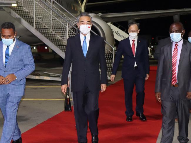 Chinese Foreign Minister Wang Yi (C) touched down in the Solomon Islands this week as the first stop in his Pacific tour. (Photo by STRINGER / AFP)