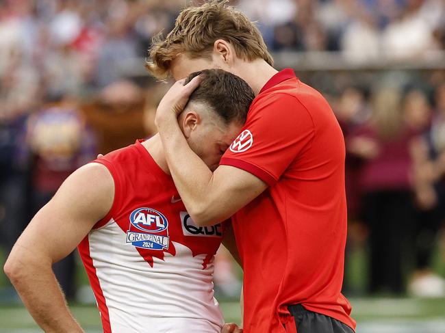 Callum Mills comforts Tom Papley.