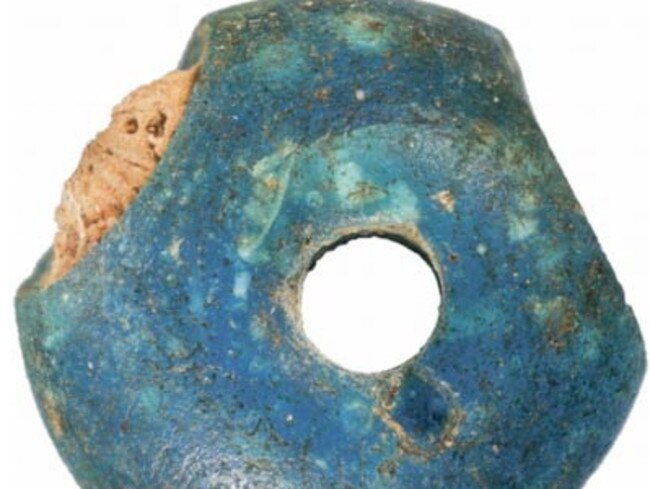 The blue beads discovers by archaeologists. <i>Credit: Denmark National Museum </i>