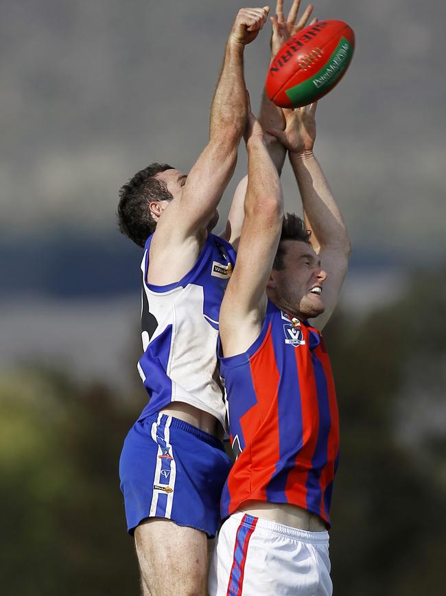 James Petrie spoils a mark during a clash against the Hepburn Kookaburras in 2014.