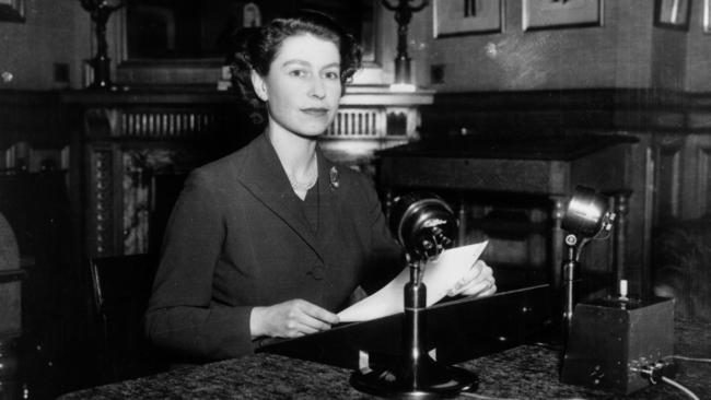 Queen Elizabeth II making her first ever Christmas broadcast to the nation, from Sandringham House, in 1952. Picture: Fox Photos/Hulton Archive/Getty Images)