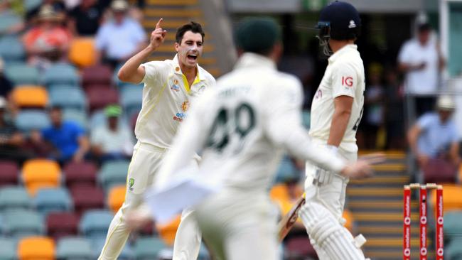 Pat Cummins celebrates after the wicket of Rory Burns. Picture: AFP Images