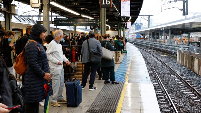 Commuters waiting for their train at Sydney's Central Station. Picture: Richard Dobson