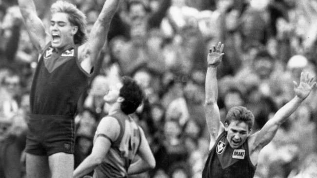 Andy Lovell and Ricky Jackson celebrate Melbourne’s win on the final siren. Picture: Colin Bull.