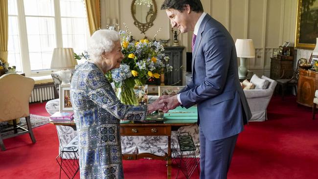 Queen Elizabeth II receives Canadian Prime Minister Justin Trudeau in front of a huge bouquet of flowers in the Ukrainian flag colours. Picture: Steve Parsons – WPA Pool/Getty Images