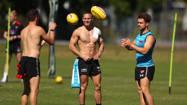 Essendon players train in the Gold Coast sunshine at Metricon Stadium this week