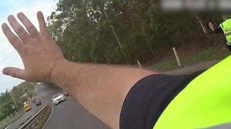 The moment before a police officer was hit by a stolen Mercedes. Picture: QPS