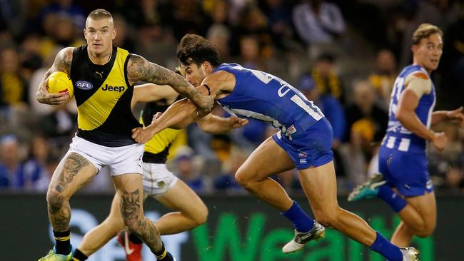 Dustin Martin tries to avoid the Kangaroo chasers. Picture: Getty Images.