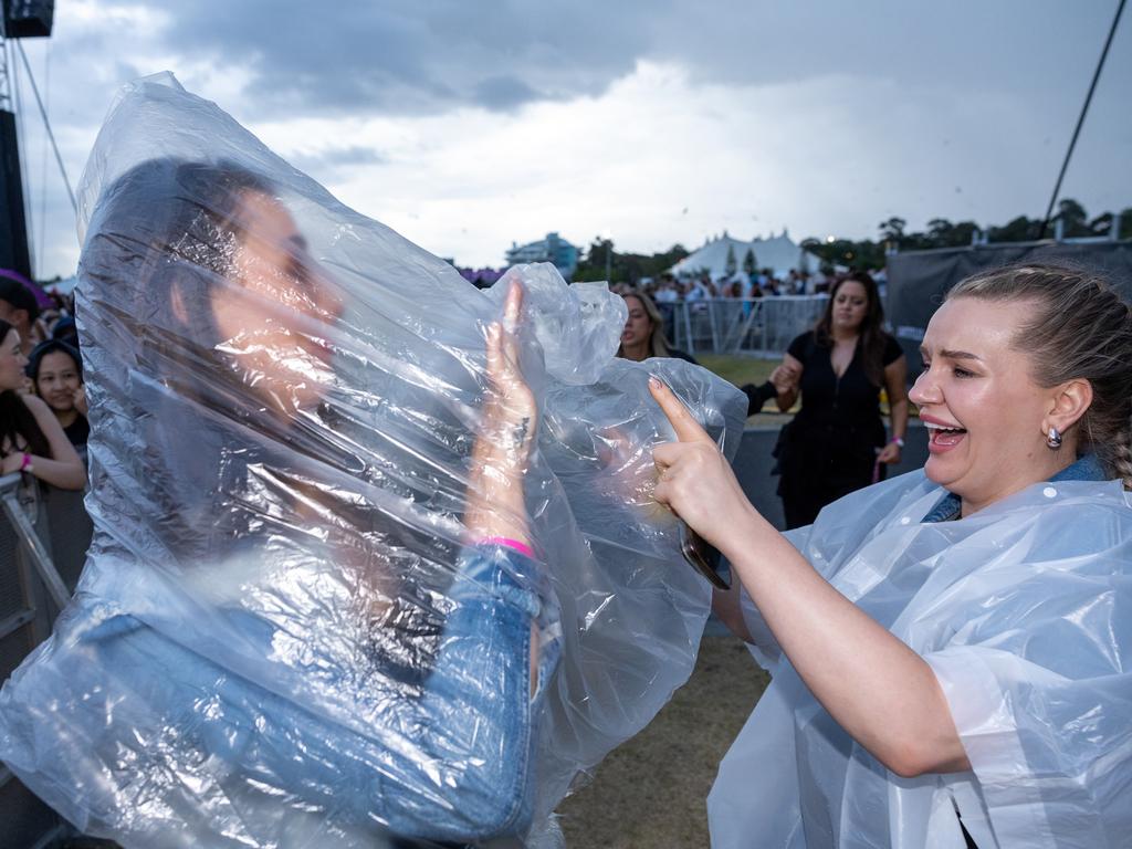 Concertgoers were seen in ponchos and raincoats. Picture: Jason Edwards