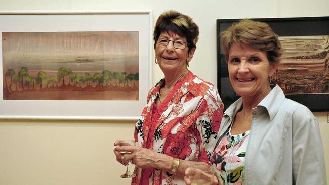 WILL BE MISSED: Alison Iszlaub (left) and Jill Copeland admiring the artwork on display at the Wondai Art Gallery in 2012. Picture: Rowan Hunnam