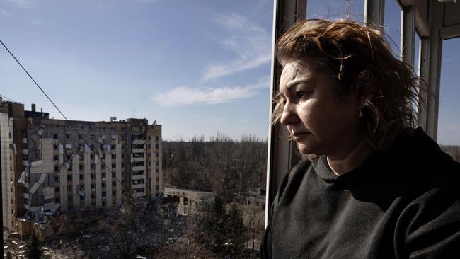 Iryna Petrochenko , 50, looks out from damaged apartment after a Russian missile attack happened killing a 47-year-old woman and wounding nine others on March 12 in Kryvyi Rih, Ukraine. Picture: Getty Images