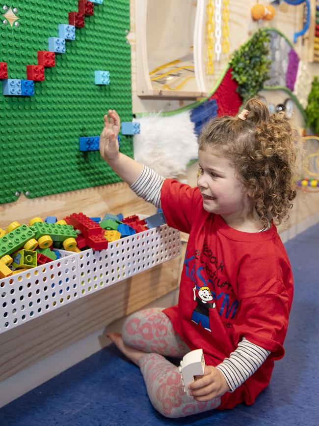 Odette, 4, plays with the sensory wall. Picture: Ellen Smith