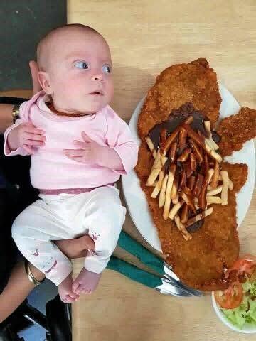 WHAT A STEAK: Sarah Atkins was amazed to see the Pinnacle Pub crumbed steak was bigger than one of her four-month-old twin daughters, Jorja. Picture: Sarah Atkins