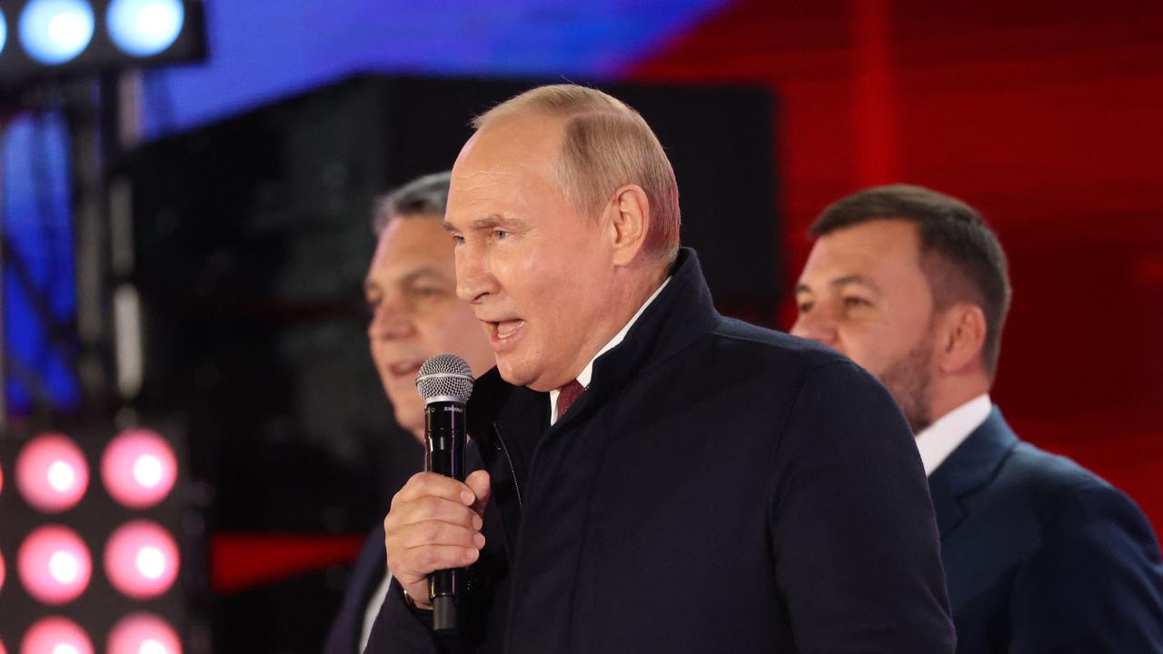 Russian President Vladimir Putin addresses a rally marking the annexation of four regions of Ukraine. (Photo by Sergei KARPUKHIN / SPUTNIK / AFP)