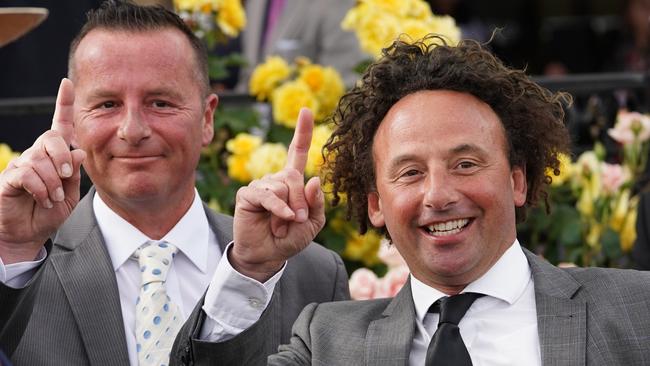 Mathew Ellerton and Simon Zahra celebrate after their horse Aristia rode to victory in race 8, the Kennedy Oaks, during the Kennedy Oaks Day, as part of the Melbourne Cup Carnival, at Flemington Racecourse in Melbourne, Thursday, November 8, 2018. (AAP Image/David Crosling) NO ARCHIVING, EDITORIAL USE ONLY