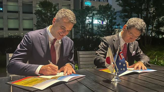 Peter Malinauskas and a Mitsubishi representative sign a hydrogen statement of co-operation in Japan October 2022. Picture: Supplied