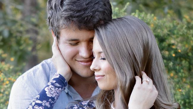 Chandler Powell and Bindi Irwin higging