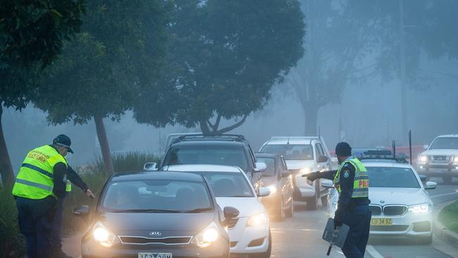 NSW police check drivers arriving on the NSW side of the border in Moama. Picture: Jake Nowakowski