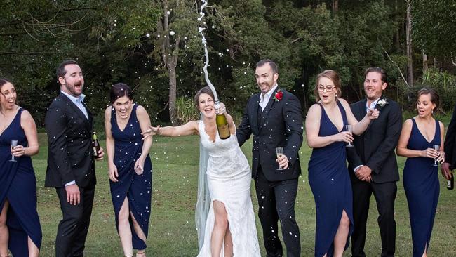 Chums: Richard Lomax and Beth Payne celebrate with bubbles and their bridal party, photography: Bec Pattinson Photography